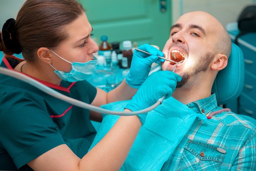 man gets dental cleaning
